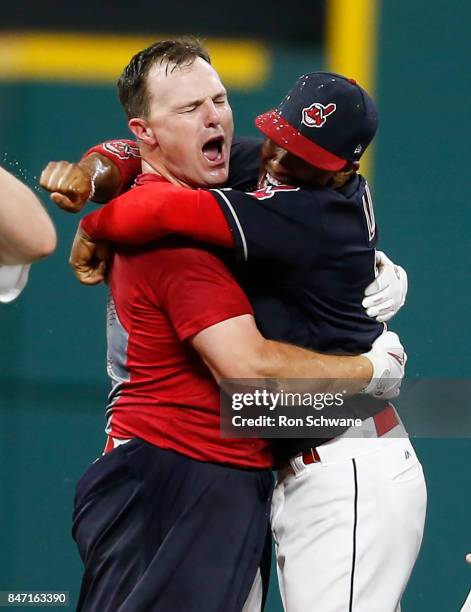 Jay Bruce of the Cleveland Indians celebrates with Francisco Lindor after hitting a game winning single off Brandon Maurer of the Kansas City Royals...