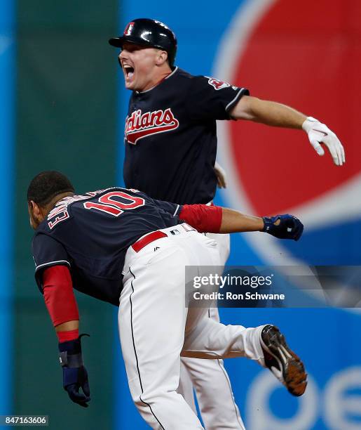 Jay Bruce of the Cleveland Indians celebrates wirh Edwin Encarnacion after hitting a game winning single off Brandon Maurer of the Kansas City Royals...