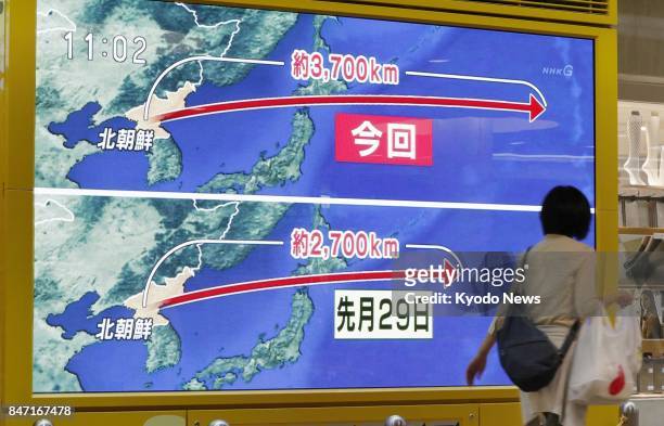 Display on a Sapporo street reports a North Korean ballistic missile flew over the northern Japan island of Hokkaido into the Pacific Ocean on Sept....