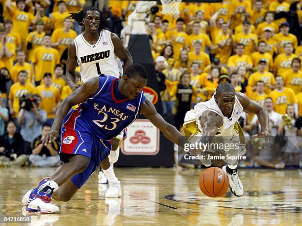 Mario Little of the Kansas Jayhawks battles J.T. Tiller of the Missouri Tigers for a loose ball during the game on February 9, 2009 at Mizzou Arena...