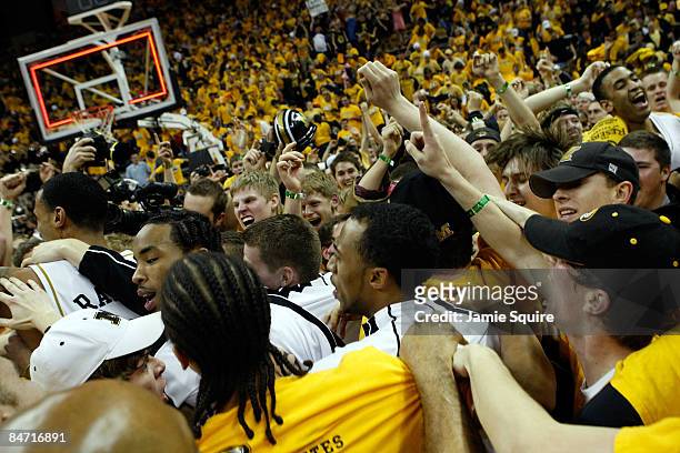 Missouri Tigers fans storm the court to celebrate with players after the Tigers defeated the Kansas Jayhawks 62-60 on February 9, 2009 at Mizzou...