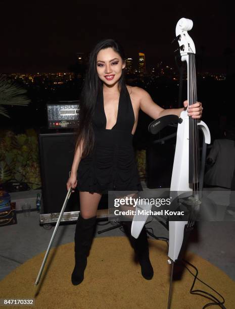 Cellist Tina Guo performs during the Warner Bros. Home Entertainment and Intel presentation of "Wonder Woman in the Sky" at Dodger Stadium on...