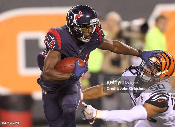 Tyler Ervin of the Houston Texans breaks a tackle from Jordan Evans of the Cincinnati Bengals during the second half at Paul Brown Stadium on...