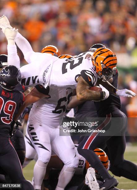 Jeremy Hill of the Cincinnati Bengals jumps over the pile for a first down against the Houston Texans during the second half at Paul Brown Stadium on...