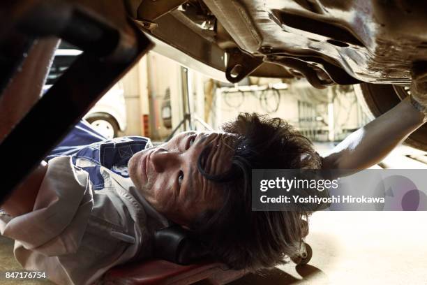 mechanic working sincerely at a japanese automobile repair shop - car passion stock pictures, royalty-free photos & images
