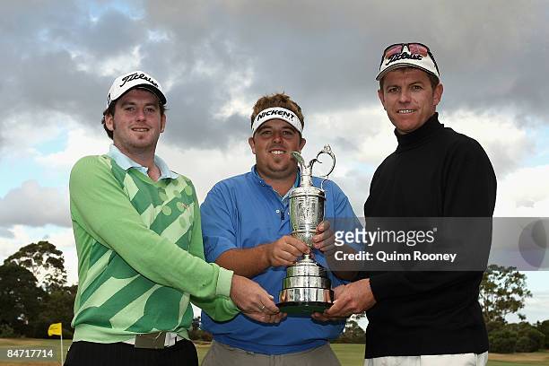 Josh Geary of New Zealand, Timothy Wood of Australia and Michael Wright of Australia pose with the trophy after being the top three qualifiers in the...