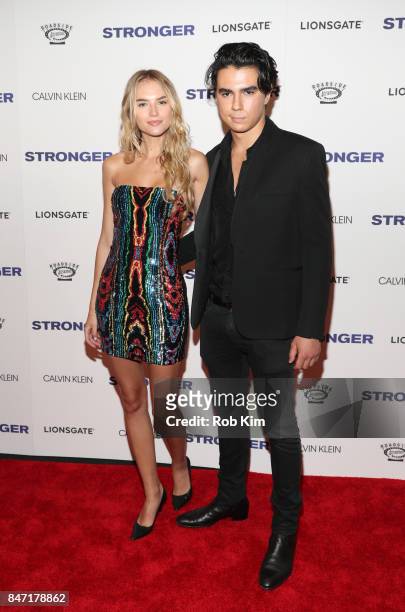 Sasha Litvak with Guest attend the premiere of "Stronger" at Walter Reade Theater on September 14, 2017 in New York City.