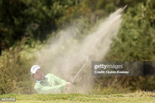 Josh Geary of New Zealand plays out of the bunker on the eleventh hole during the Australasia International Final Qualifying for The 2009 Open...