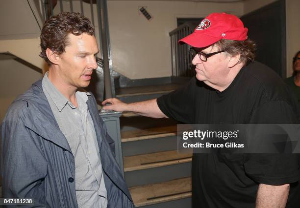 Benedict Cumberbatch and Michael Moore chat backstage at the hit play "Michael Moore: The Terms of My Surrender" on Broadway at The Belasco Theatre...