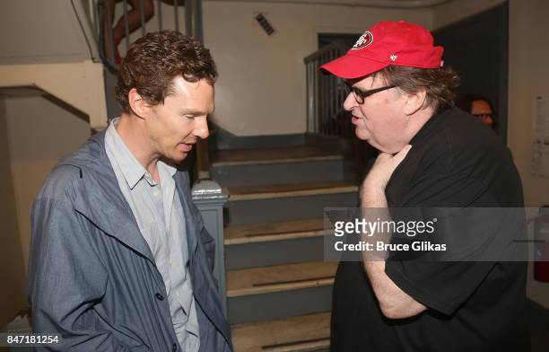 Benedict Cumberbatch and Michael Moore chat backstage at the hit play "Michael Moore: The Terms of My Surrender" on Broadway at The Belasco Theatre...