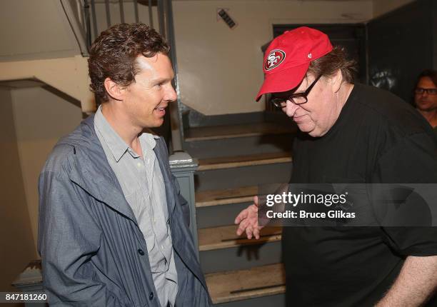 Benedict Cumberbatch and Michael Moore chat backstage at the hit play "Michael Moore: The Terms of My Surrender" on Broadway at The Belasco Theatre...