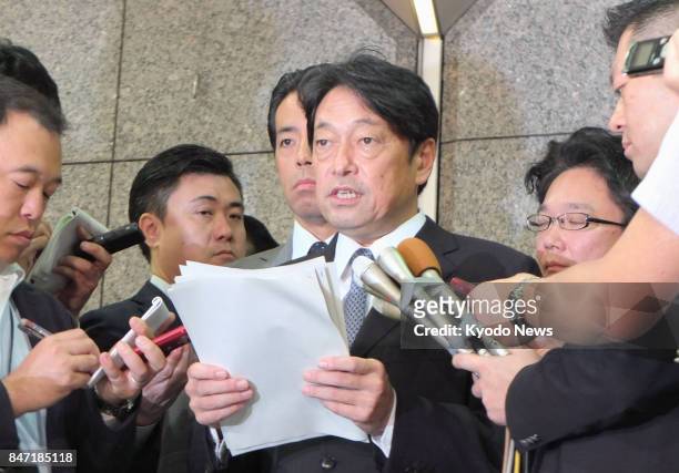 Japanese Defense Minister Itsunori Onodera speaks to reporters in Tokyo on Sept. 15 after North Korea launched another ballistic missile over the...