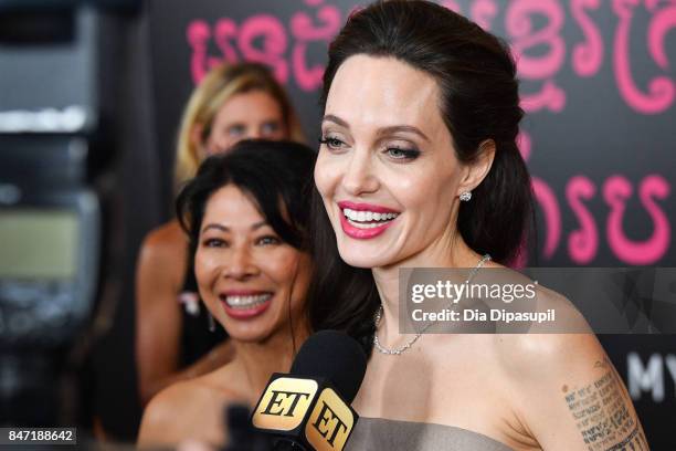 Angelina Jolie and author Loung Ung attend the "First They Killed My Father" New York premiere at DGA Theater on September 14, 2017 in New York City.