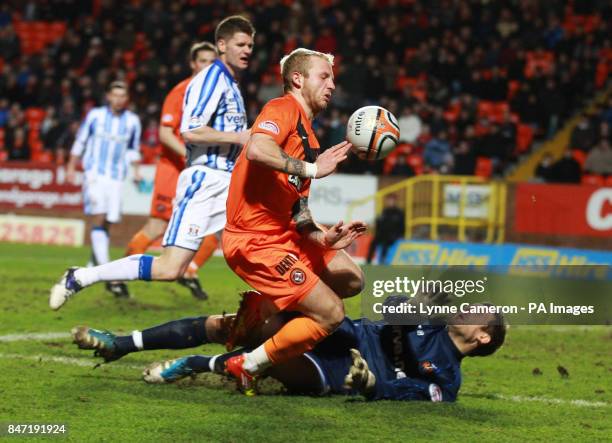 Kilmarnock's Cameron Bell and Dundee United's Johnny Russell during the Clydesdale Bank Scottish Premier League match at Tannadice Stadium, Dundee.