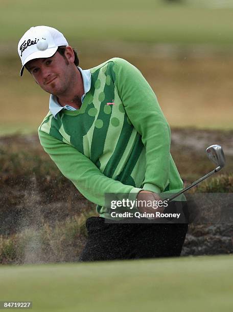 Josh Geary of New Zealand plays out of the bunker on the ninth hole during the Australasia International Final Qualifying for The 2009 Open...