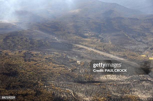 The immediate aftermath of a wildfire which threatened one of the main electricity transmission lines to Melbourne, destroying farms and the Bunyip...