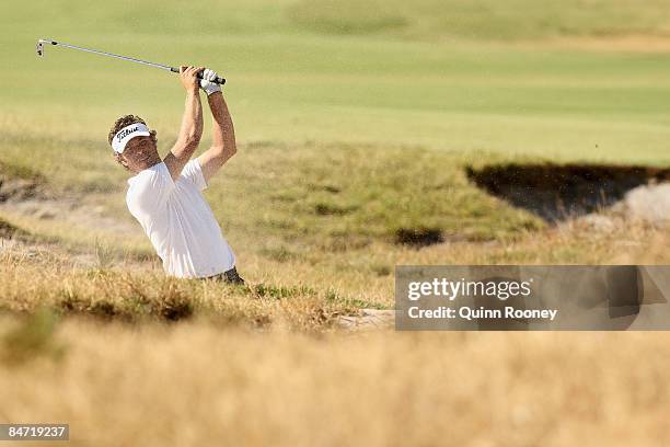 Craig Scott of Australia plays out of the bunker on the fifteenth hole during the Australasia International Final Qualifying for The 2009 Open...