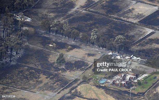 Ruins of a home and sheds after a wildfire ripped through the area destroying thousands of hectares of farmland and eucalypt forest near Bunyip, some...