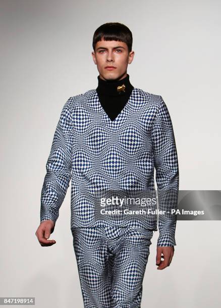 Model on the catwalk during the J.W. Anderson Men London Fashion Week show at St Martins College of Art and Design, London.