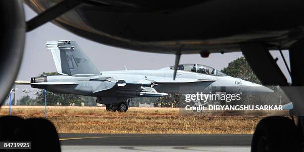 Navy F/A-18F Super Hornet strike aircraft taxis following a flight demonstration at the Yelahanka Air Force Station in Bangalore on February 10 ahead...