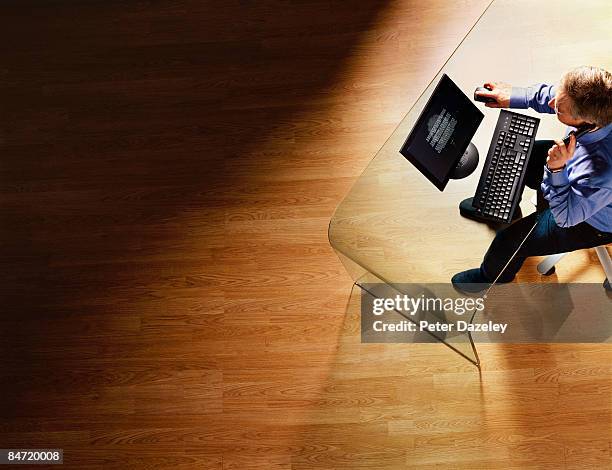 businessman working at computer. - cordless phone stock pictures, royalty-free photos & images