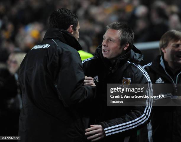 Brighton & Hove Albion manager Gus Poyet and Hull City manager Nick Barmby meet on the touchline prior to the npower Football League Championship...