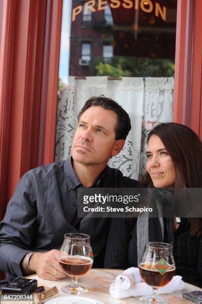 Portrait of married American couple, Jazz musician Kurt Elling and dancer Jennifer Elling, as they sit together at a sidewalk restaurant, New York,...