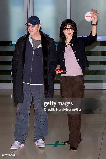 French actress Sophie Marceau and actor Christophe Lambert arrive at the Incheon International Airport on February 10, 2009 in Seoul, South Korea.