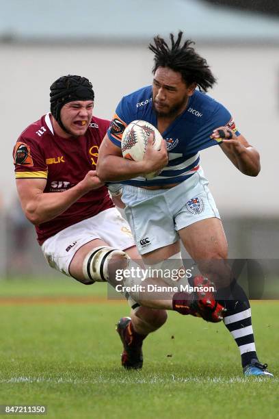 Faiane of Auckland is tackled during the round five Mitre 10 match between Southland and Auckland at Rugby Park Stadium on September 15, 2017 in...