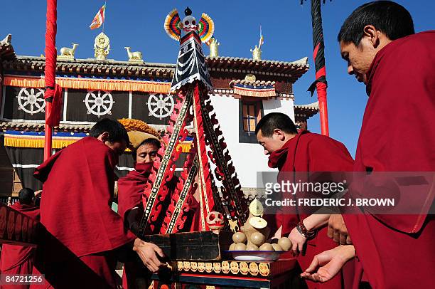 Tibetan Buddhist monks make preparations for Cham Dances during celebrations for Monlam, or the Great Prayer Festival, at the Gomar Gompa on February...