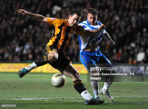 Hull City's Matty Fryatt and Brighton & Hove Albion's Alan Navarro battle for the ball during the npower Football League Championship match at the KC...