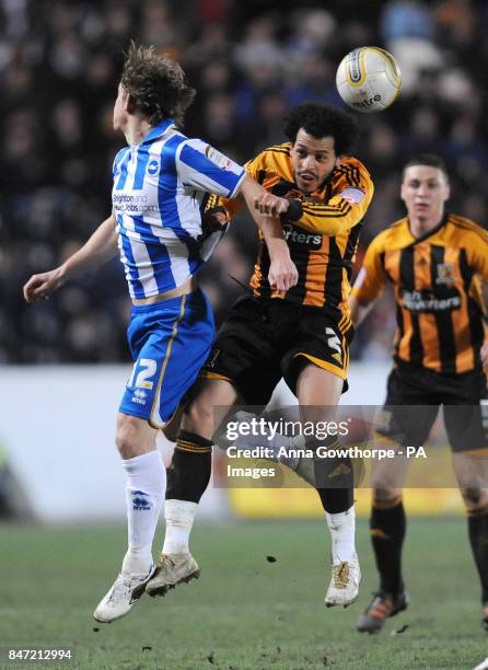 Brighton & Hove Albion's Craig Mackail-Smith and Hull City's Liam Rosenior battle for the ball during the npower Football League Championship match...