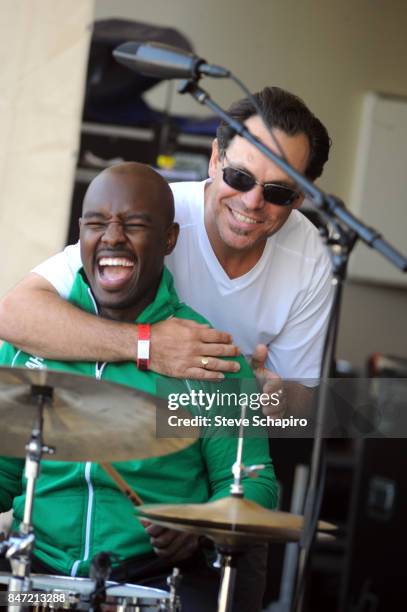 American Jazz musicians Ulysses Owens Jr and Kurt Elling share a laugh onstage during a soundcheck before the Chicago Jazz Festival in Grant Park,...