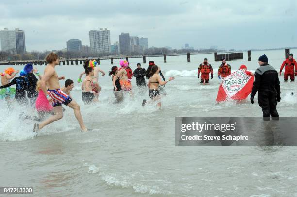 View of participants in a Chicago Polar Plunge event as they run into Lake Michigan , Chicago, Illinois, 2010.