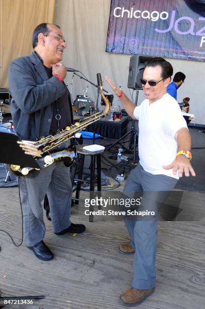 American Jazz musicians Ernie Watts and Kurt Elling share a laugh onstage during a soundcheck before the Chicago Jazz Festival in Grant Park,...