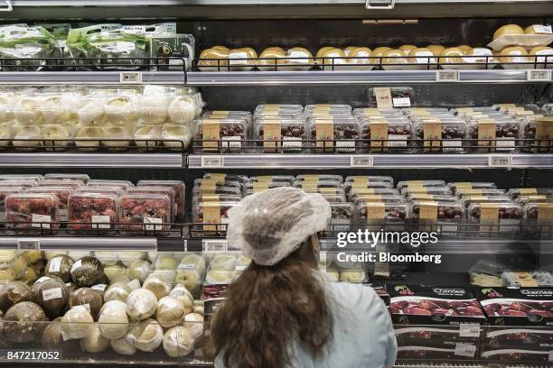 An employee stocks the shelves in the chilled goods section at an Alibaba Group Holding Ltd. Hema Store in Shanghai, China, on Tuesday, Sept. 12,...