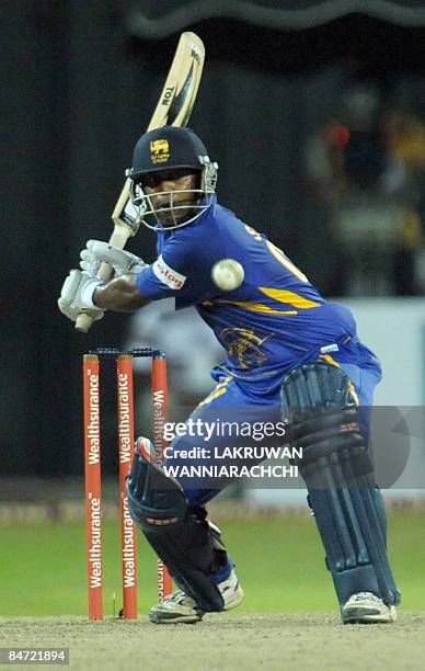 Sri Lankan cricketer Chamara Silva plays a stroke durng the Twenty20 International match between India and Sri Lanka at the R Premadasa Stadium in...