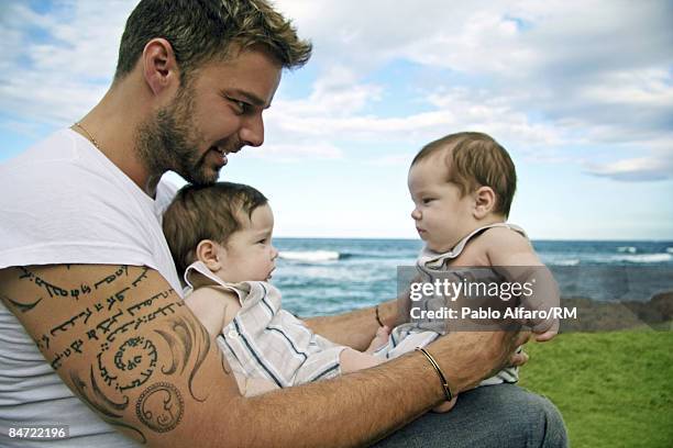 Ricky Martin poses with sons Valentino Martin and Matteo Martin on November 19, 2008 in San Juan, Puerto Rico.
