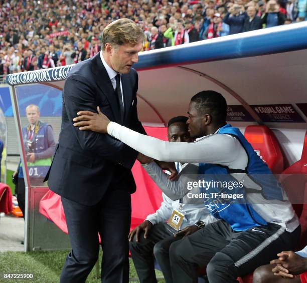 Head coach Ralph Hasenhuettl shakes hands with Yvon Lar Mvogo Nganoma of Leipzig during the UEFA Champions League group G match between RB Leipzig...