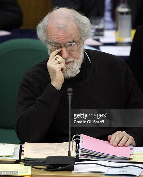 The Archbishop of Canterbury, Dr Rowan Williams wipes his eye after addressing the Church of England General Synod in Church House on February 10,...
