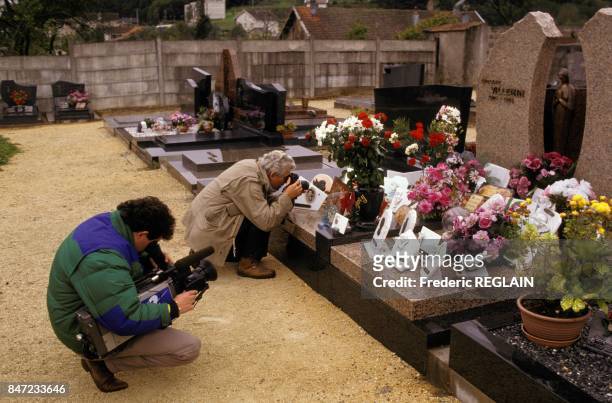 Photographers on the grave of Gregory Villemin for the 3rd anniversary of the murder of young boy at age 4 on October 16, 1987 in France.