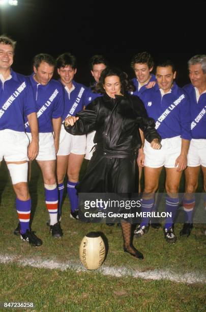 Minister of Health Michele Barzach kicking off rugby match between journalists and polticians on October 17, 1987 in France.
