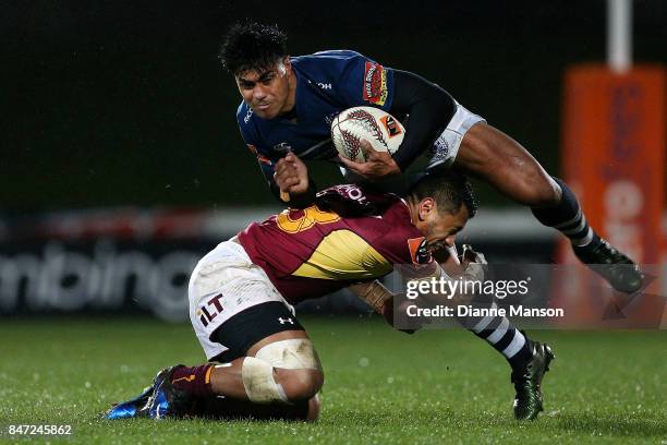 Malakai Fekitoa of Auckland is tackled by Neria Fomai of Southland during the round five Mitre 10 match between Southland and Auckland at Rugby Park...