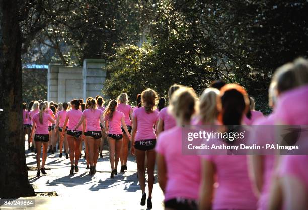 Girls wearing hot pants walk across central London during the launch of Veet EasyWax's nationwide competition to search for Britain's Greatest Legs,...