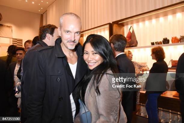 Anggun and her husband Olivier Maury attend the Loewe Cocktail As part of "La Fete Des Vendanges" At Avenue Montaigne on September 14, 2017 in Paris,...