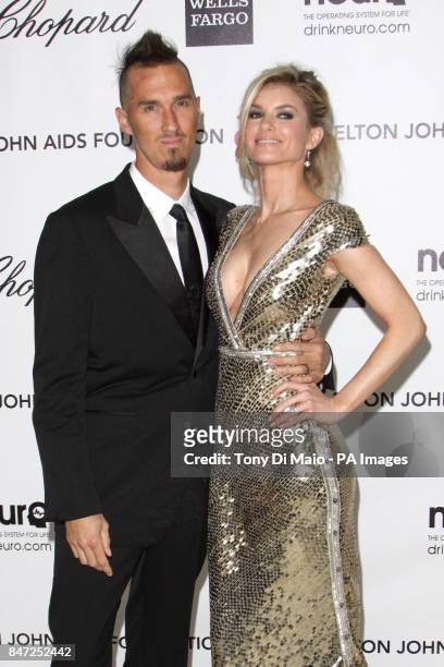 Marissa Miller and Griffin Guess arriving for the Elton John Aids Foundation Academy Awards Viewing Party at West Hollywood Park in Los Angeles, USA.