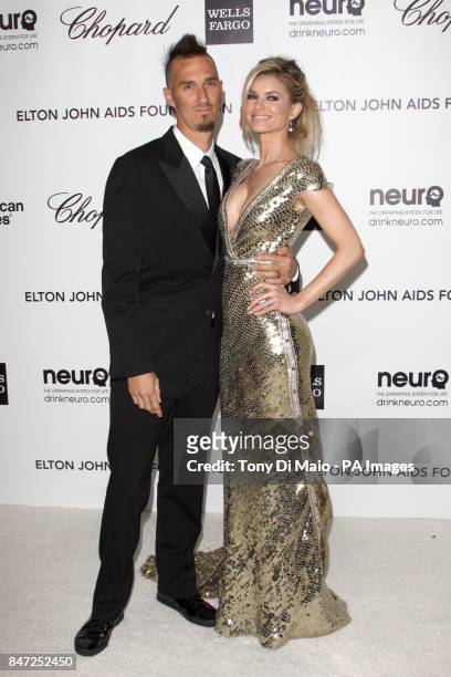 Marissa Miller and Griffin Guess arriving for the Elton John Aids Foundation Academy Awards Viewing Party at West Hollywood Park in Los Angeles, USA.