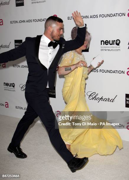 Kelly Osbourne and guest arriving for the Elton John Aids Foundation Academy Awards Viewing Party at West Hollywood Park in Los Angeles, USA.