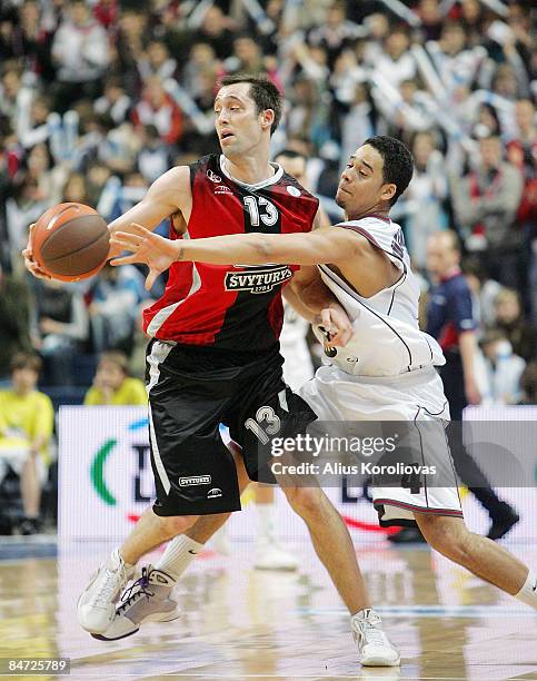 Chuck Eidson, #13 of Lietuvos Rytas competes with Flavio Stuckemann, #4 of Artland Dragons in action during the Eurocup Basketball Last 16 Game 3...