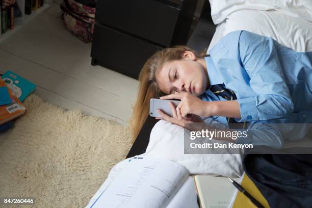 teenage girl aged 14 in bedroom - killing time stock pictures, royalty-free photos & images